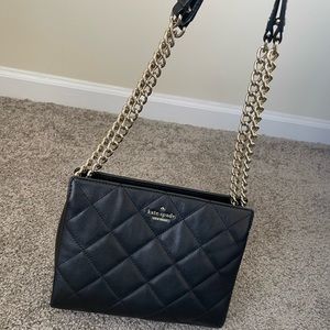 A black crossbody bag from Kate spade.